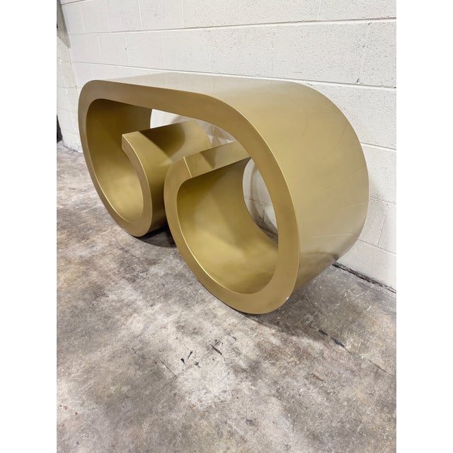I believe this may have been a prototype. Never produced. Super cool. Gold painted concrete? Waterfall style console....