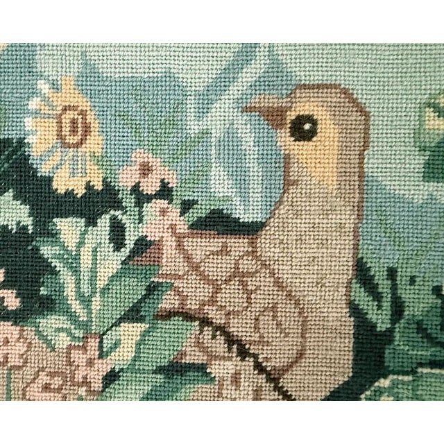 Framed botanical with doves needle work has been hand stitched with wool yarns. Soft muted color pallet was used to create...