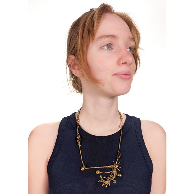 A mid-century modern brass Brutalist necklace. In the style of Jack Boyd & Pal Kepenyes. With an abstract organic...