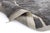 A winding path through a field of deep shadow. Scattered rectangular forms in soft ivory float across a rich charcoal gray...