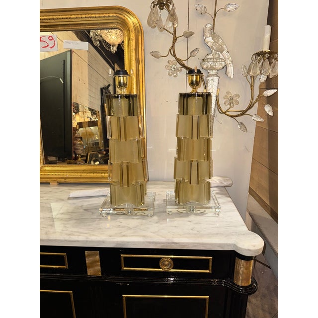 The product is a pair of modernist matte gold lamps, perfect for the dining room. Designed for adults, these lamps add a...