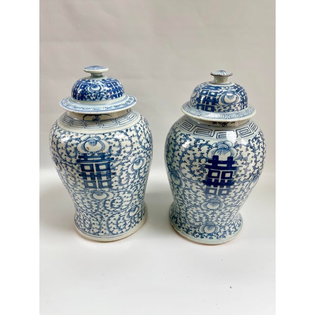 Pair of large antique 19th-century blue and white Chinese porcelain ginger jars. Maker's mark on underside.