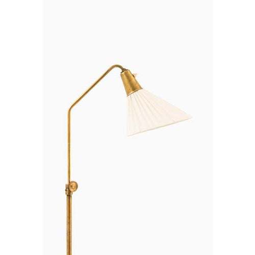 This rare height-adjustable floor lamp, designed by hans bergström and produced by asea in sweden during the 1950s,...