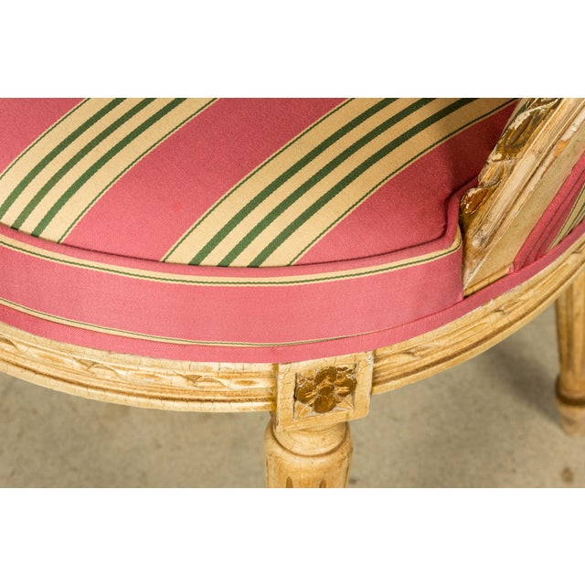 An exceptional set of six early 20th-century French Louis XVI style dining chairs, sourced in Paris, France. The chairs...