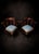 An elegant and highly decorative pair of carved mahogany corner chairs in the Chippendale style, combining graceful...