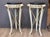 A pair of early 20th C. Northern European cream painted and parcel-gilt pedestals, each with a circular black marble top...