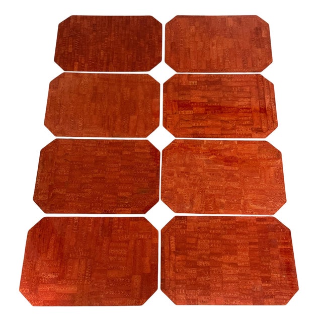Impressive set of 8 heavy tessellated coral placemats. Banded on all sides in silver. Cork backed. By Maitland Smith.