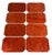 Impressive set of 8 heavy tessellated coral placemats. Banded on all sides in silver. Cork backed. By Maitland Smith.