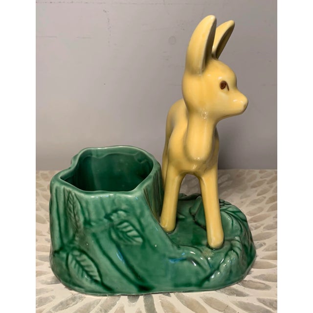Vintage 1950’s Figural deer or fawn planter made by California Pottery. The colors are yellow and green. Measures 7.5”H x...
