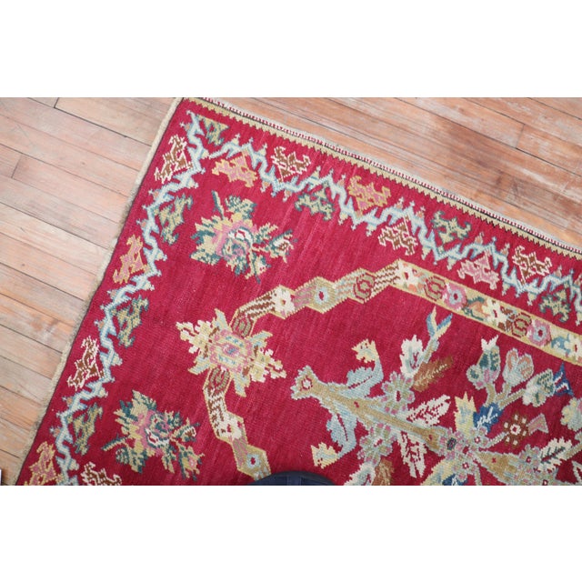 A charming handmade small antique Turkish rug. Predominantly raspberry including other exotic colors. Measures: 3'3'' x...