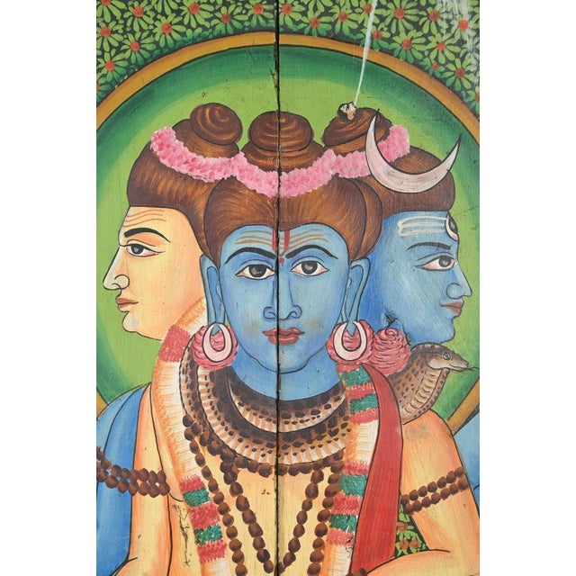 This Vintage Indian Painted Panel is hand-painted by skilled artisans, depicting a traditional Hindu deity in vibrant...