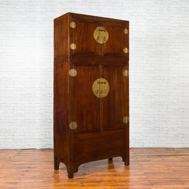 A Chinese Qing Dynasty period elm and burl wood compound multiseason cabinet from the 19th century, with four doors, inner...