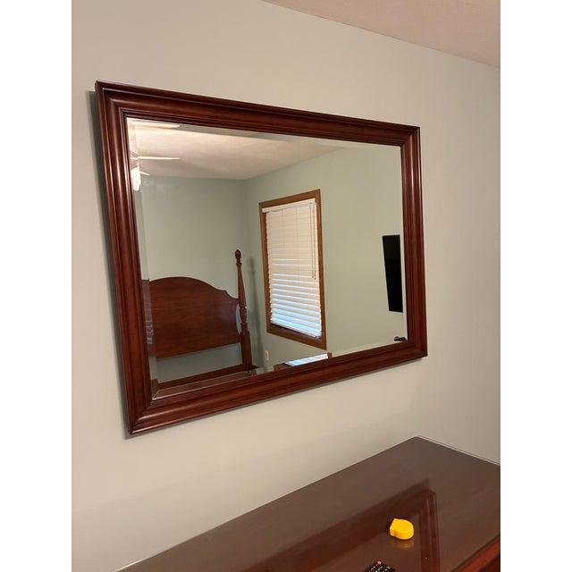 Wild black cherry wood wall mirror by Henkel-Harris. 44.5 inches long 34.5 inches tall