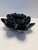 A sculptural handmade ceramic bowl formed as a layered lotus blossom, finished in a rich midnight-blue glaze with hand-...