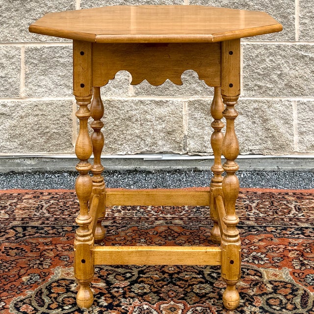 A vintage Ethan Allen Circa 1776 collection Colonial Early American solid maple side table having an octagonal top with a...