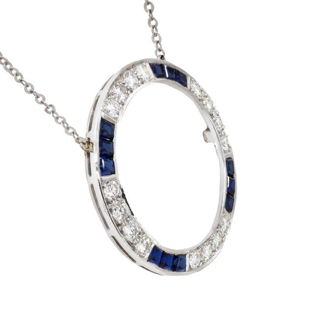 Platinum necklace with re-purposed Art Deco circle brooch containing 16 transition cut. high color/clarity round brilliant...