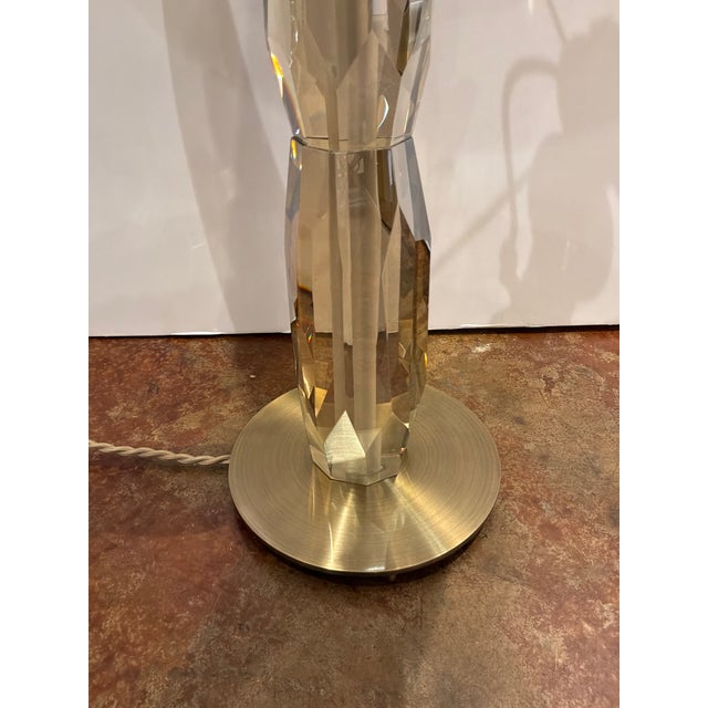 Stylish Revelation Multifaceted Table Lamp. Gold round base and hardware, multifaceted crystal body, white round shade....