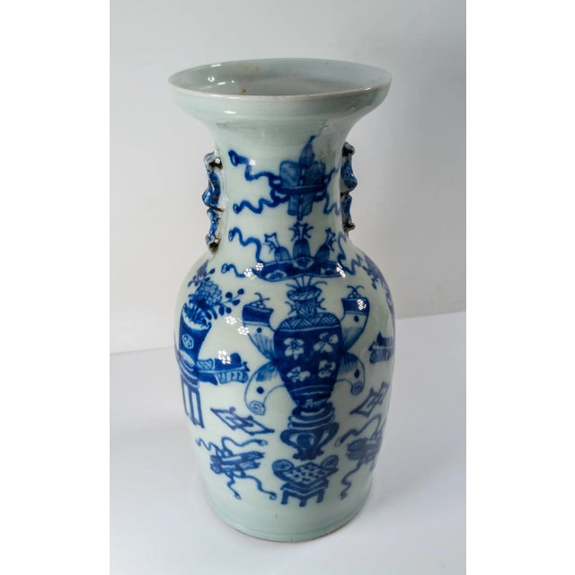 We are selling this decorative Chinese underglaze blue vase with celadon glazed surface. The vase has decoration of 100...