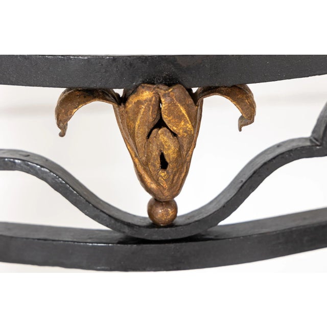 A Large 19th Century French Wrought Iron Console Table with Marble Top. Of interesting shape, this table has a lovely...