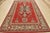 This traditional tribal geometric Caucasian Kazak rug is hand-knotted with an all-wool pile on a cotton foundation. This...