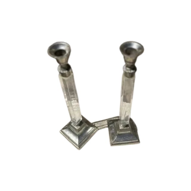 Unique, Early 20th Century Art Deco style candlesticks to shine light beautifully in any space.
