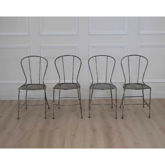 Made in France in the nineteenth century, this set of four wrought-iron garden or park chairs dates from the Napoleon III...