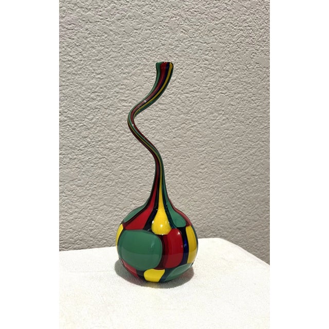 Vintage Twisted hand blown bottle in Bright Bold Colors: Red, Yellow, Green. This unique bottle in the style of Murano...