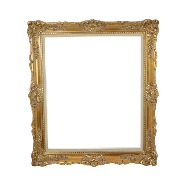 Beautiful and impressive gold-colored wooden frame, entirely in classic Baroque style, elaborately decorated with acanthus...