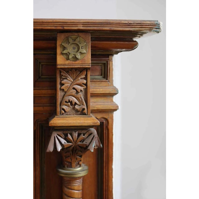 Stunning, antique, late 19th century Aesthetic Movement style walnut fireplace mantel. This piece features exquisite...