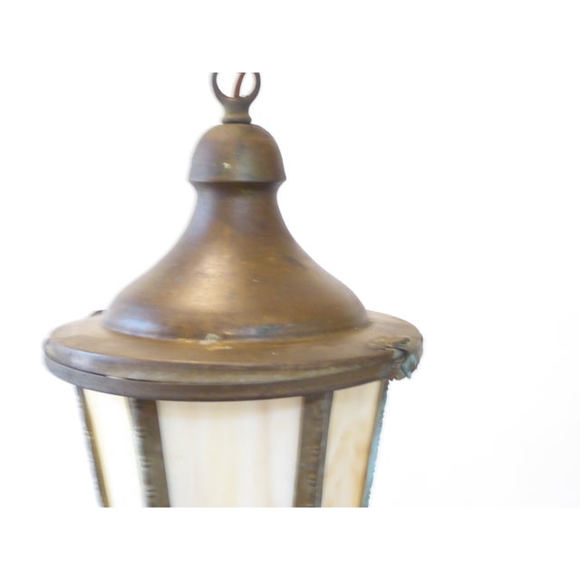 This early 20th Century small lantern with slag glass uses a single Edison base bulb up to 75 Watts. It ships with the...