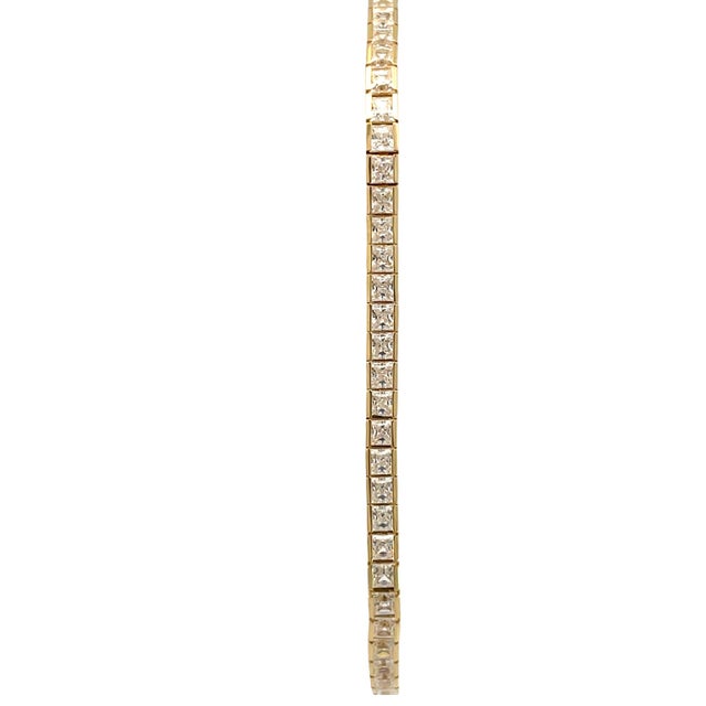 Elegant and timeless, this 14K yellow gold bracelet features a classic tennis-style design set with sparkling cubic...