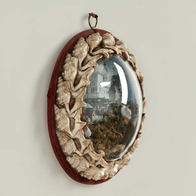 Rare and unusual English 19th century sailors valentine handcrafted with exotic seashells. Around an image of figures and...