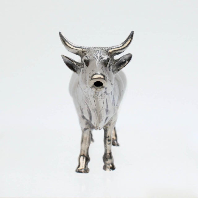 A very fine figural sterling silver creamer or milk pot by Israel Freeman & Son. In the form of a cow with a loop 'tail'...