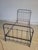 Antique style wrought iron bed frame, composed of four pieces. The two side crosspieces have an interlocking assembly...