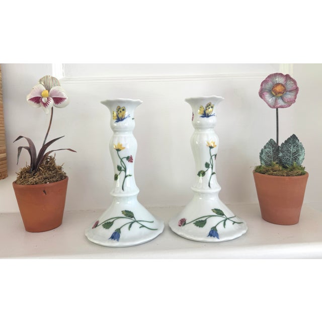 Porcelain Hand painted candle holders. Made for D Porthault by Limoges. Featuring flowers and butterflies.