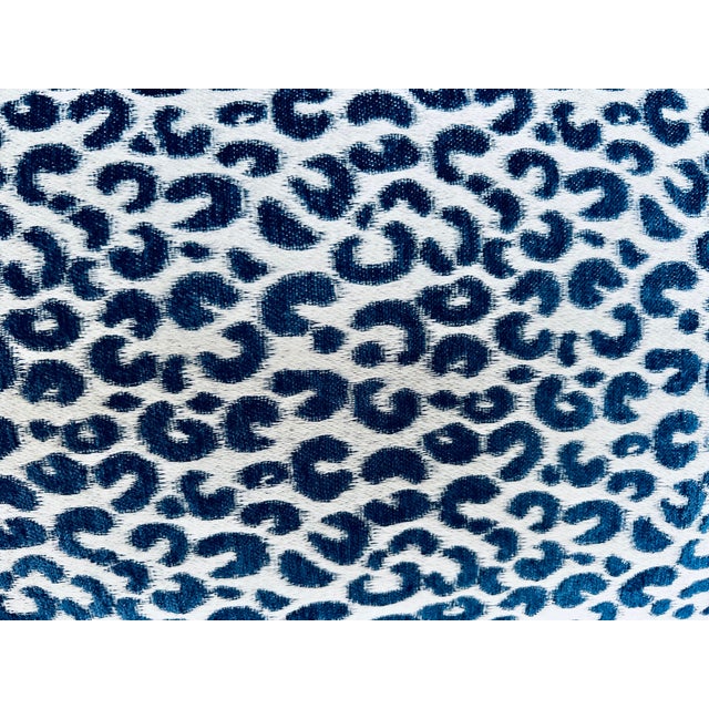 Single oblong lumbar pillow/cushion in a blue and white modern version of an animal print. There are pleated corners and a...