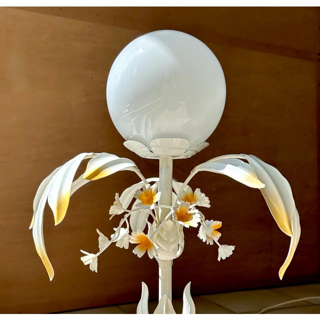 This high-quality table lamp in plant-shaped Florentine style was handcrafted in Italy during the early 1970s. It was...