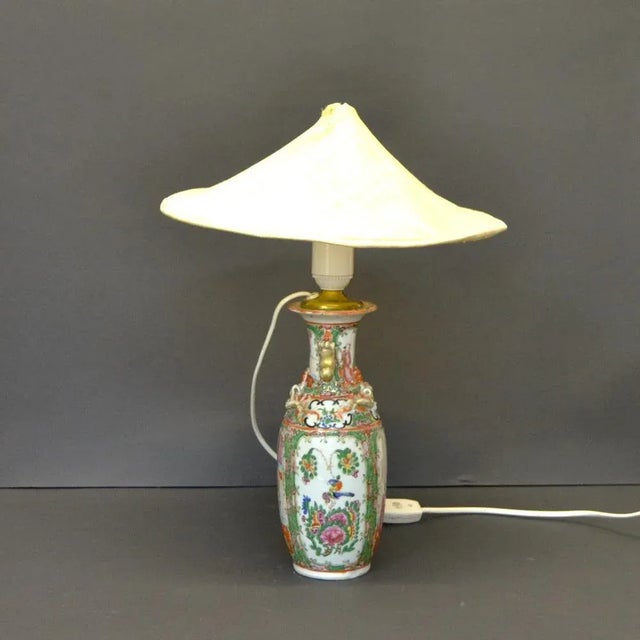 The body of the lamp was made in 19th century China from Cantonese rose export porcelain Later in the 20th century the...