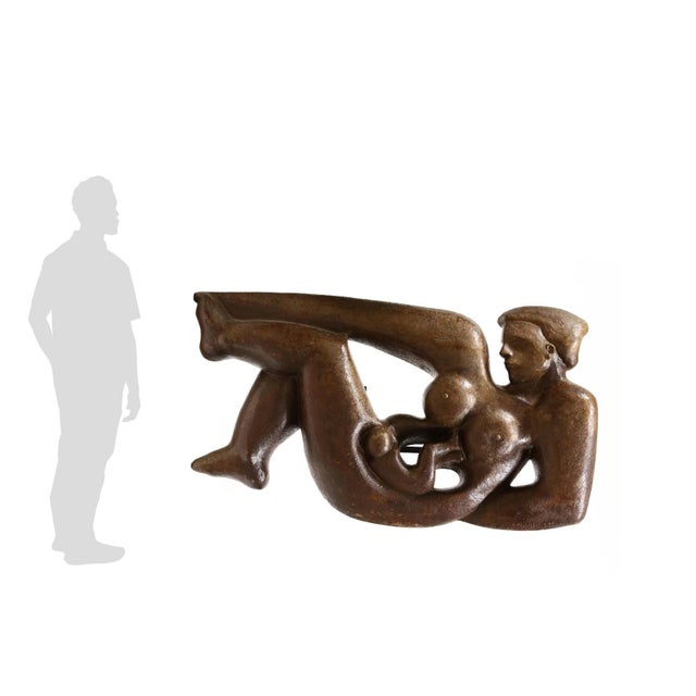 Mid-century, carved wood with applied finish, incised signature to lower right, verso with steel cleating for wall...