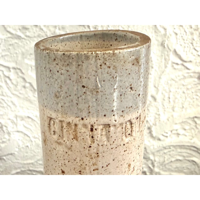 Slender handmade stoneware bud vase in a cylinder form. So pretty holding pencils or artist’s brushes. Impressed letters...