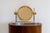 A sophisticated tabletop vanity mirror by Karl Springer, executed in polished nickel and brass with the refined, luxurious...