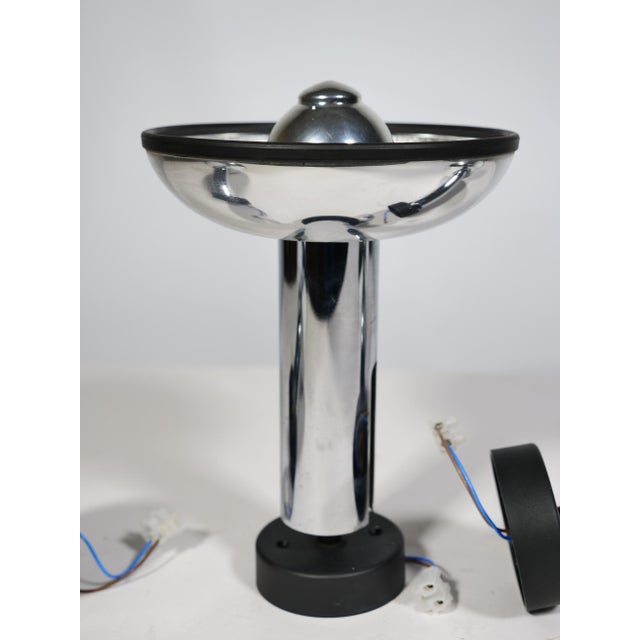 Set of 3 Space Age wall lamps by Staff. Chrome finish with black trim and reflective shade. Clean, minimalist design....