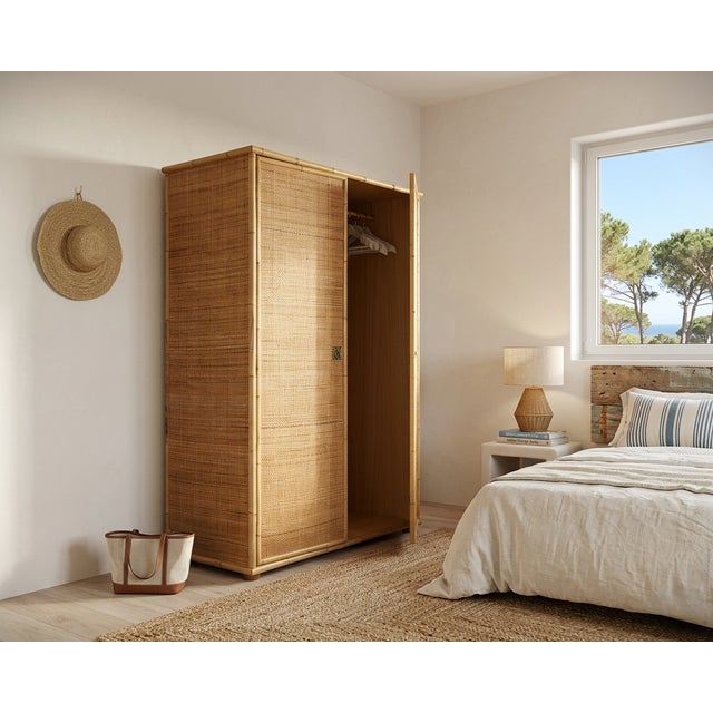 This freestanding 1970s rattan and bamboo wardrobe by dal vera perfectly captures the laid-back, sophisticated aesthetic...