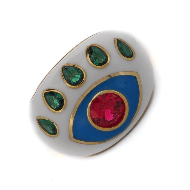 Guardian Ruby & Emerald Evil Eye White Enamel Adjustable Ring is a striking piece designed to bring both protection and...