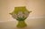 This Dana Gibson spill vase features three applied daisies on a apple green form with small handles. Whimsical, it is...