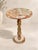 Elevate your interior with this exquisite natural onyx pedestal table, handcrafted from beautifully veined stone in a...