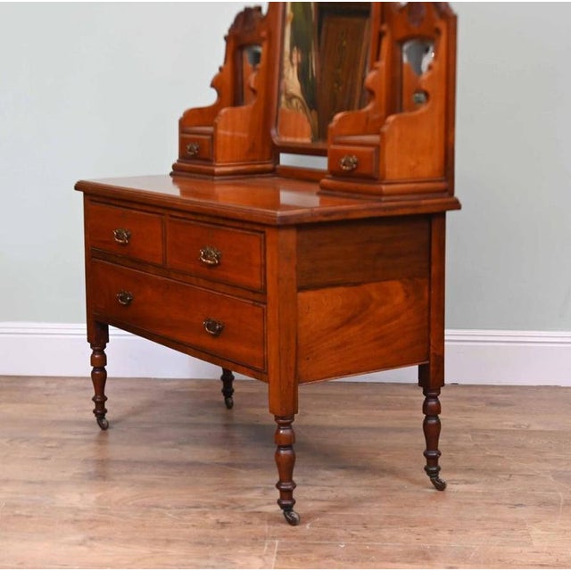 Fine Edwardian mahogany dressing chest dating from circa 1900 The raised back incorporates a large central mirror flanked...