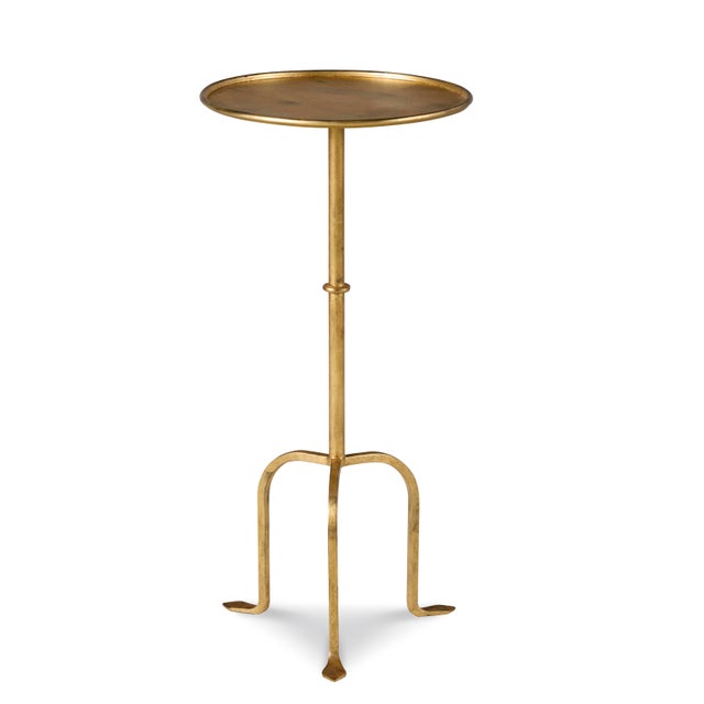 The gilded iron martini table, inspired by mid-century design, represents a fusion of elegant craftsmanship and modernist...