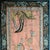 A rare early-20th century Chinese silk tapestry depicting a lively dragon procession, expertly embroidered with vibrant...
