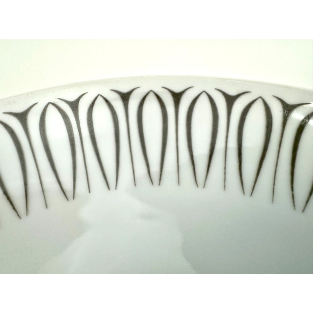 This sophisticated set of six Narumi “Escort” dinner plates, crafted in Japan by Elite Fine China, showcases a striking...